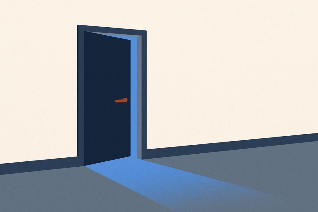 A plain door standing ajar in an otherwise blank wall, light spilling from behind it